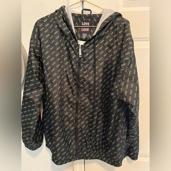 Love Love Love black windbreaker with yellow/green print.  Full zip with hood - Picture 1 of 4